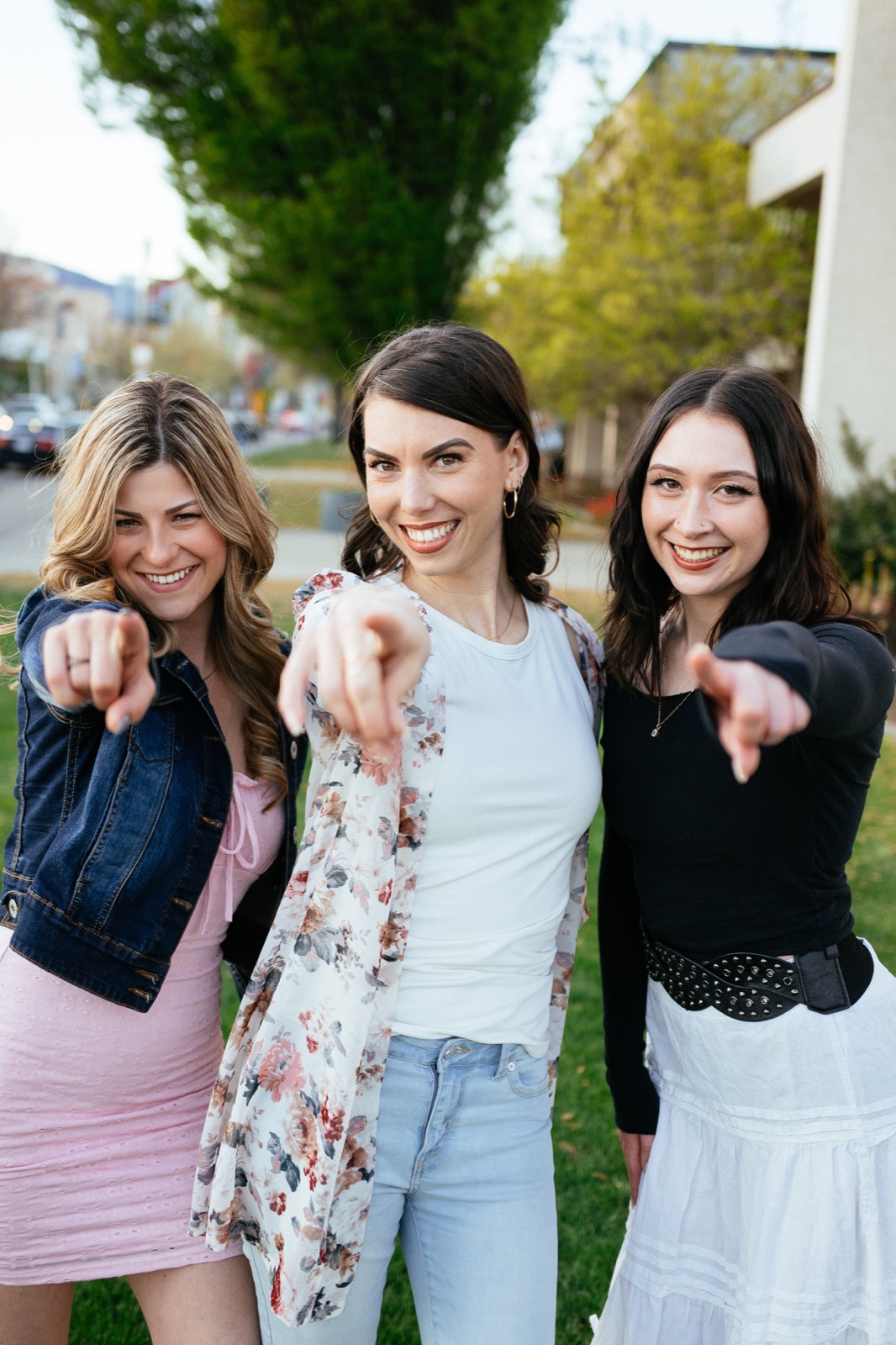 Lindsay, Sophia and Abby from Diva Den smiling together outside.